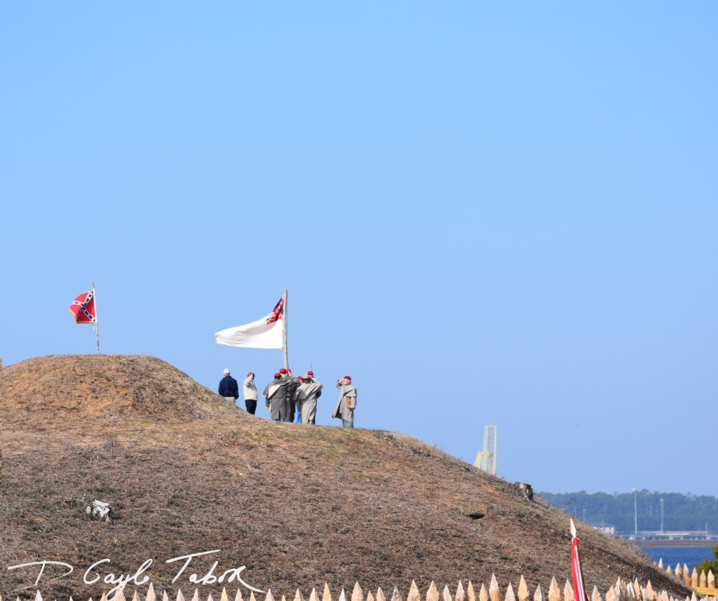 as the day began the rebel forces are seen raising the flag on the fort